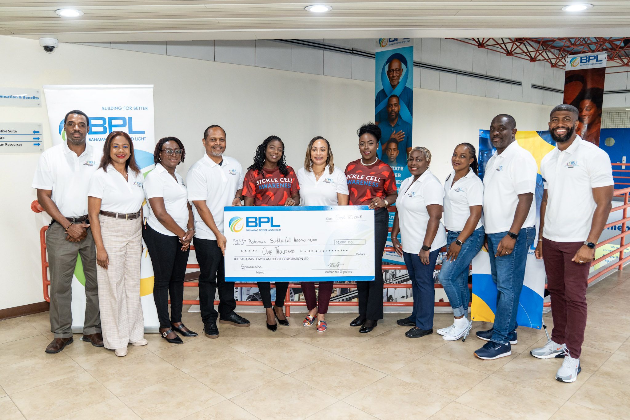 BPL executives present a donation to the Bahamas Sickle Cell Association at BPL headquarters