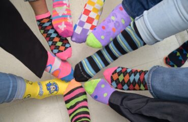 BPL Rocks Its Socks In Support of World Down Syndrome Day